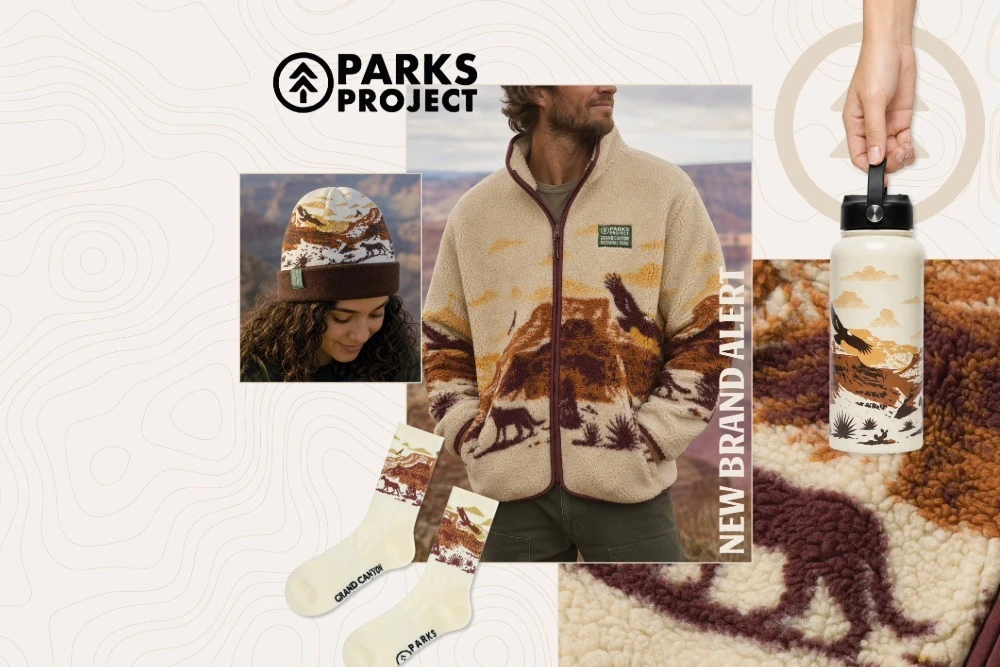 woman in beanie, and man in fleece, with socks and water bottle, all featuring the sites and animals of the grand canyon