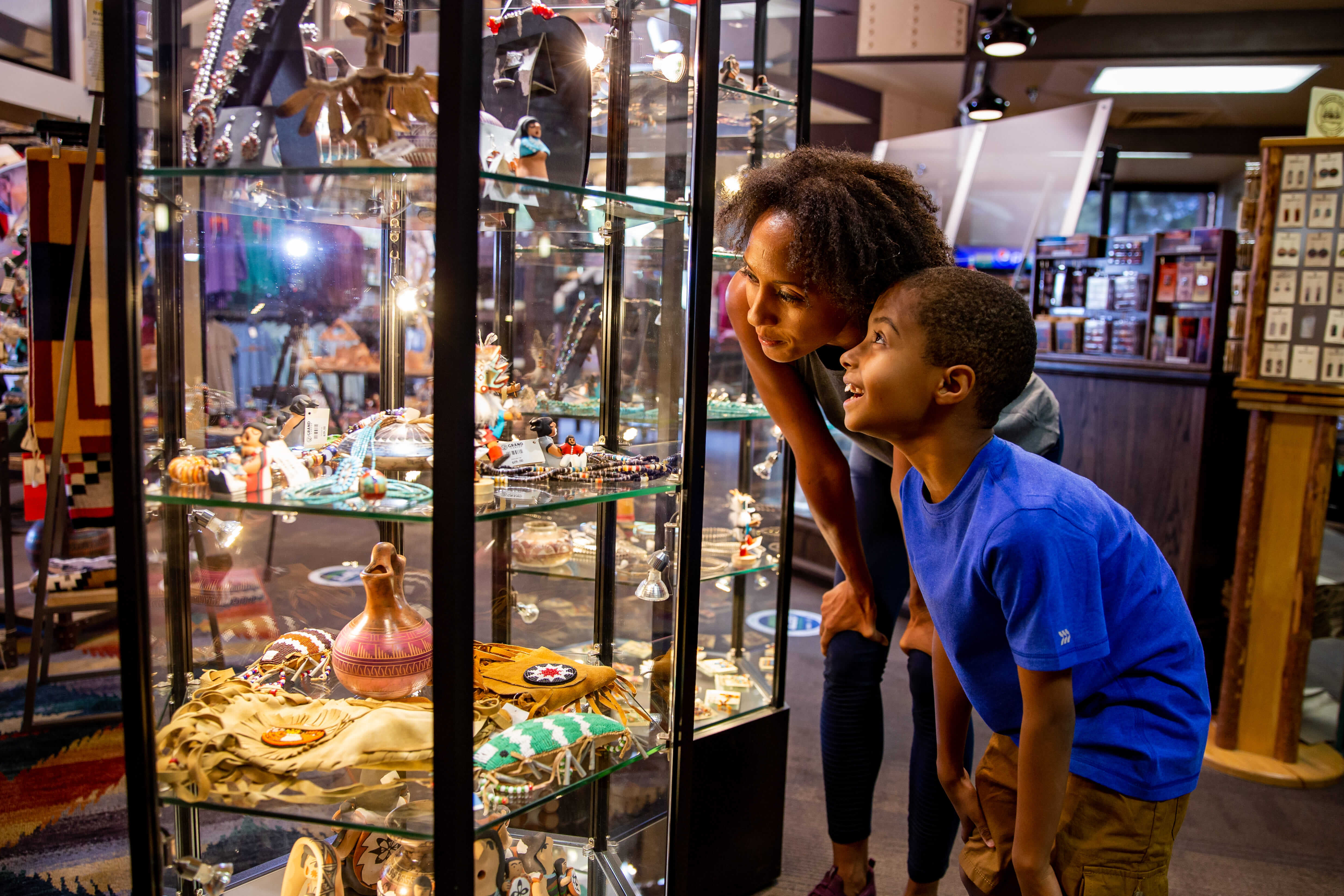 Two people looking into a glass display case at Grand Canyon Yavapai Gift Shop